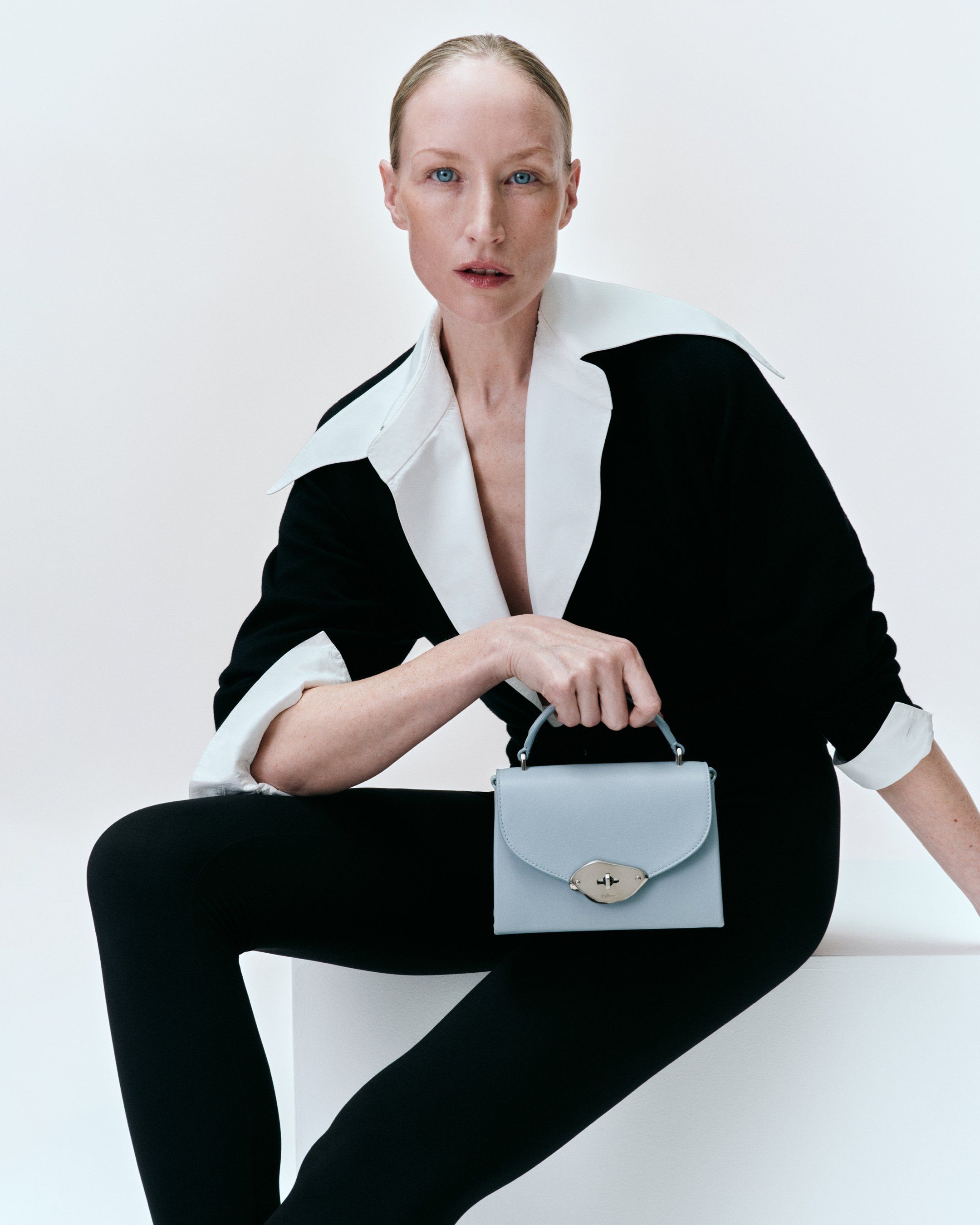 Model holding the Mulberry Lana handbag in light blue leather
